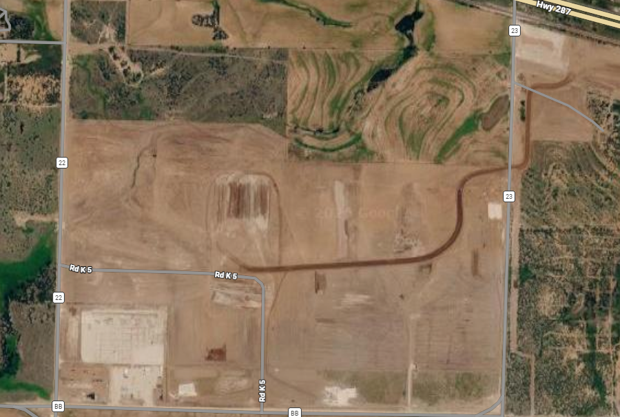 Publisher-supplied aerial site image showing land, local roads and Highway 287